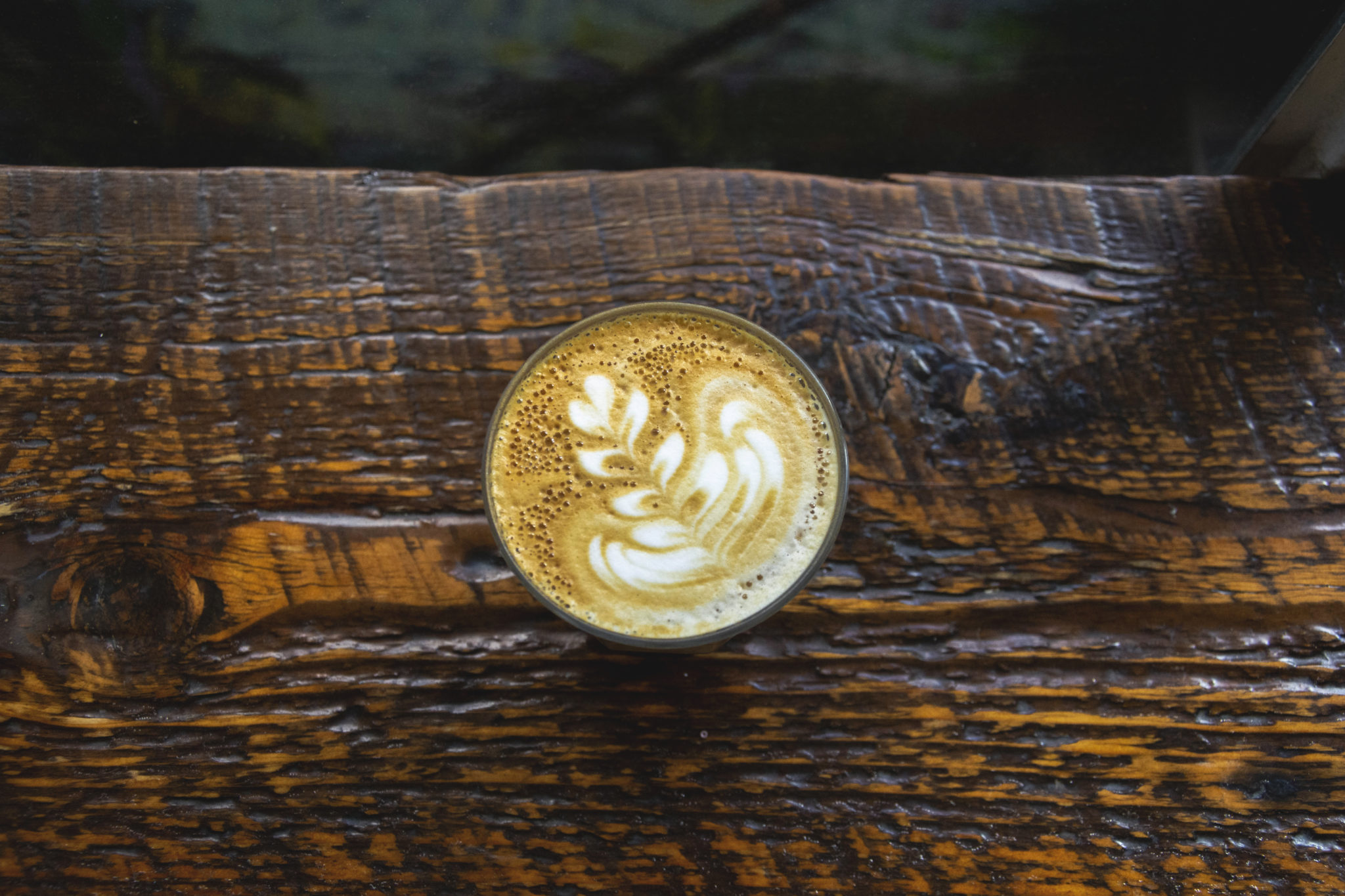 latte art on wooden shelf
